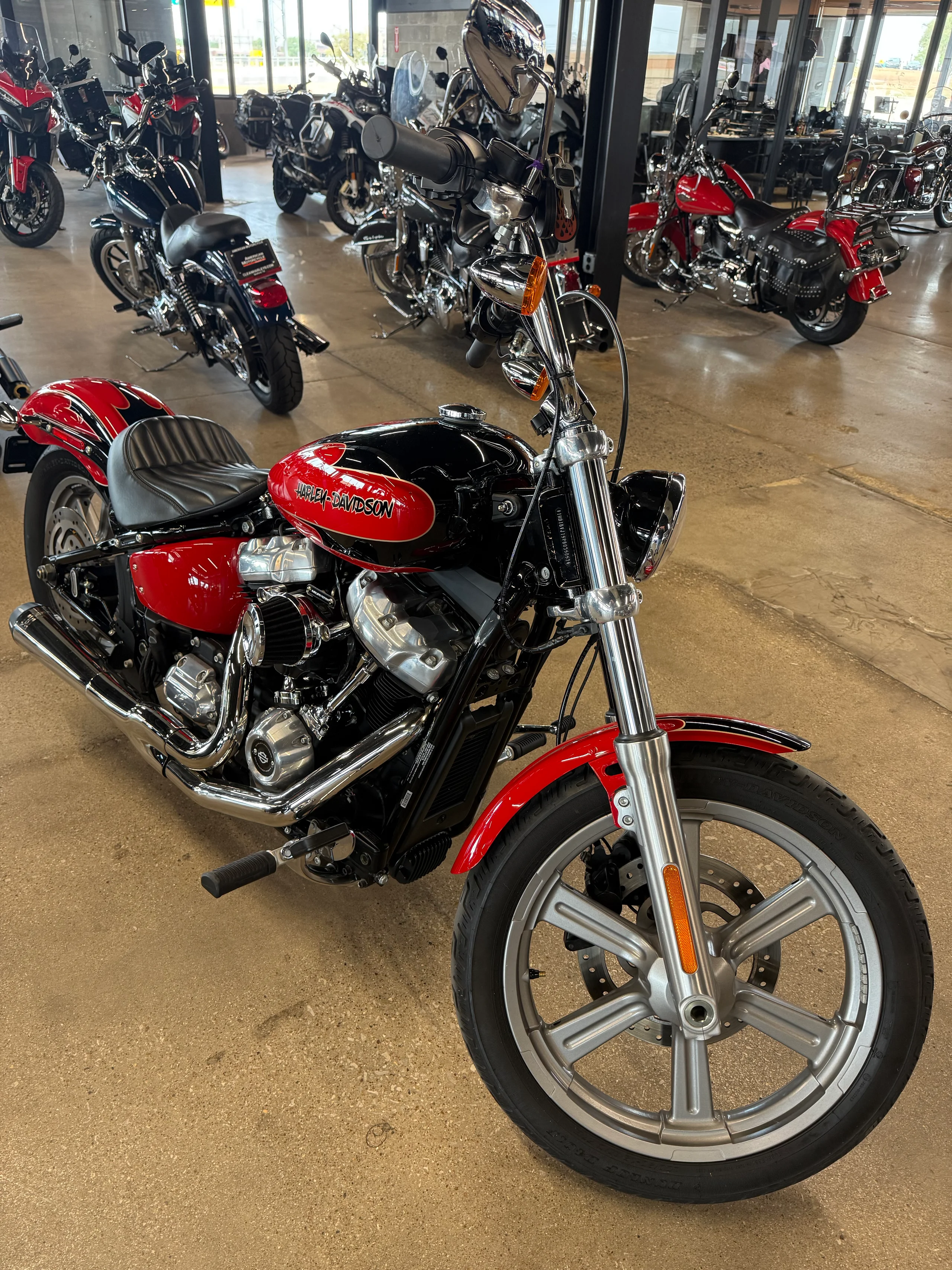 Simple Harley-Davidson cruiser motorcycle on the Clean Harleys showroom floor