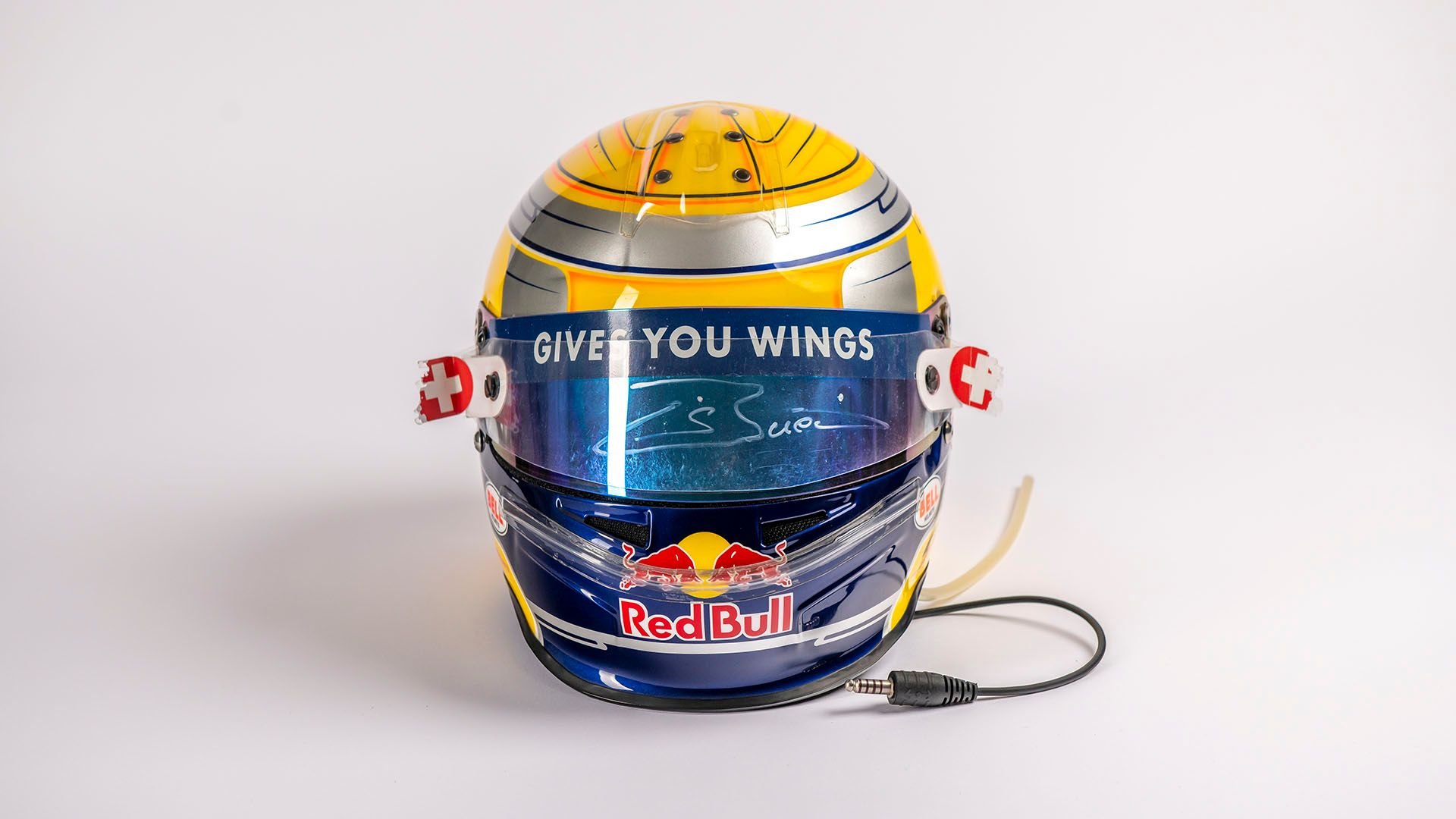 Broad Arrow Auctions | Sébastien Buemi 2009 Signed Original Toro Rosso Helmet with Hungary and European Flags to the Rear