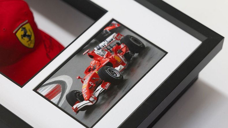 Broad Arrow Auctions | Charity Lot: Michael Schumacher Signed Framed Ferrari Cap