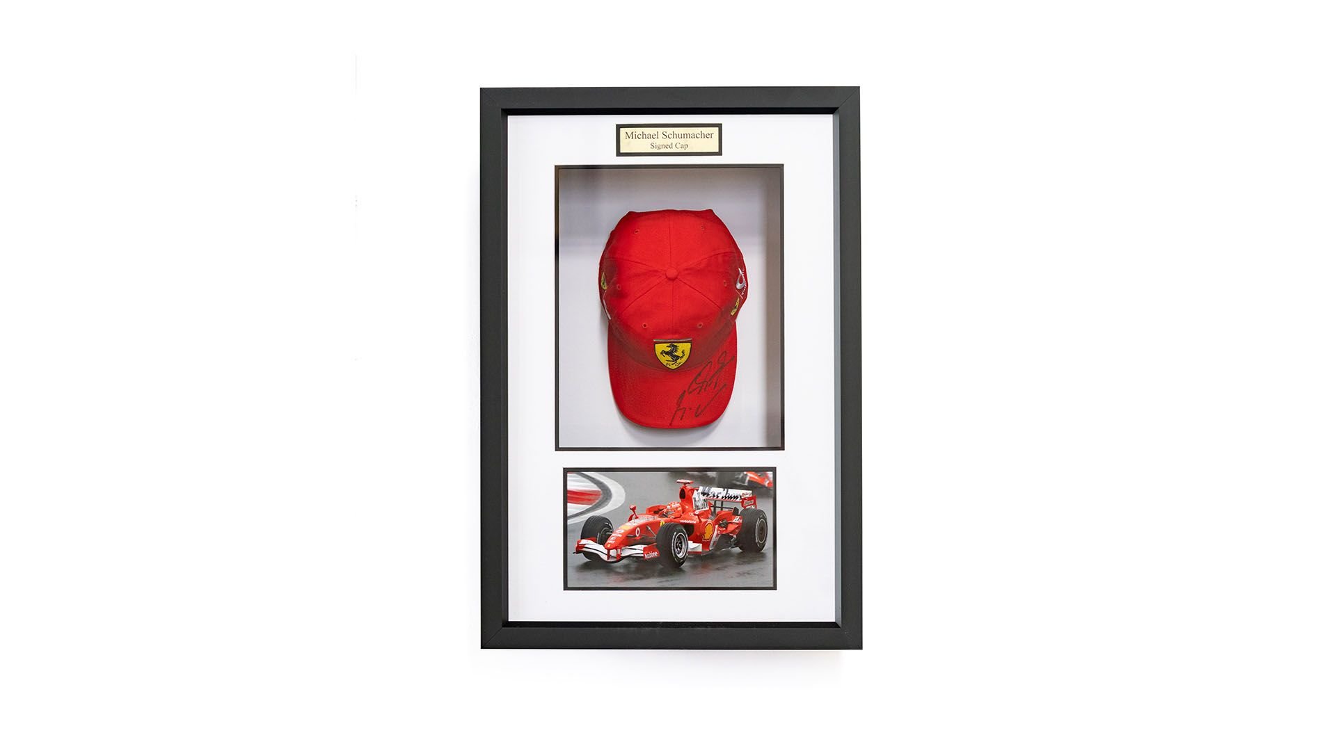 Broad Arrow Auctions | Charity Lot: Michael Schumacher Signed Framed Ferrari Cap
