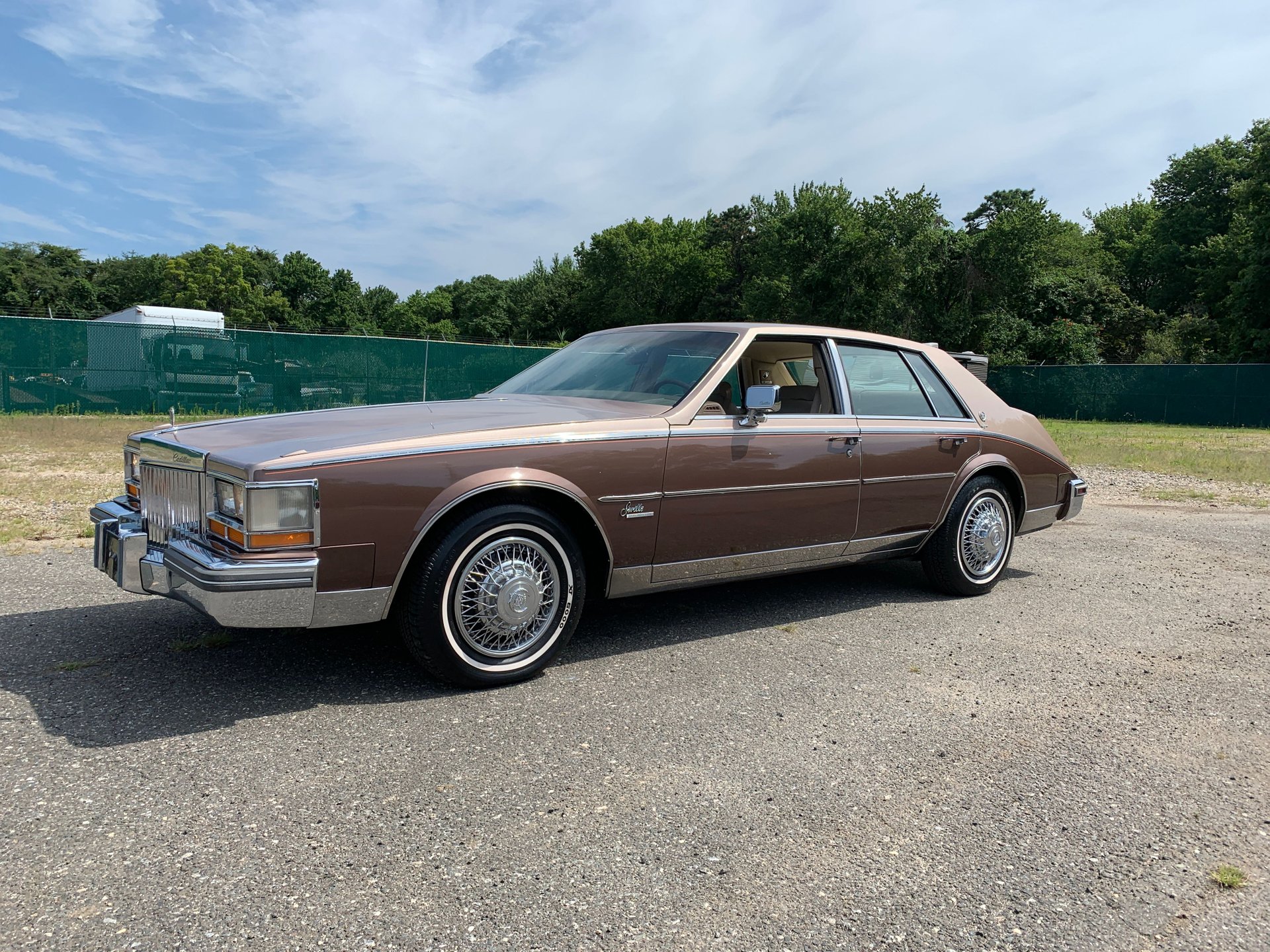 brown beige cadillac seville 1980s        
        <figure class=