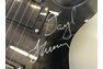 Genesis autographed black electric guitar with certificate of authenticity