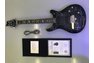 Genesis autographed black electric guitar with certificate of authenticity