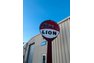 1960 Running Lion sign in 16 ft pole