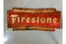 Half of a Firestone Sign Tire Display